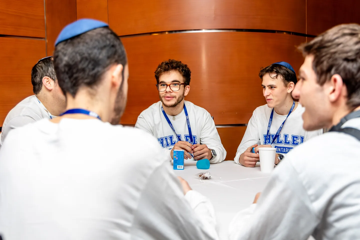 Students deep in conversation around a table.